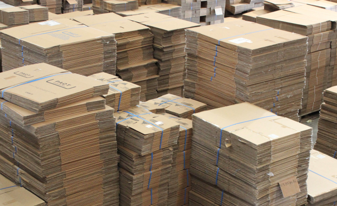 Packaging Recyclers warehouse stacked full of Cardboard Boxes.